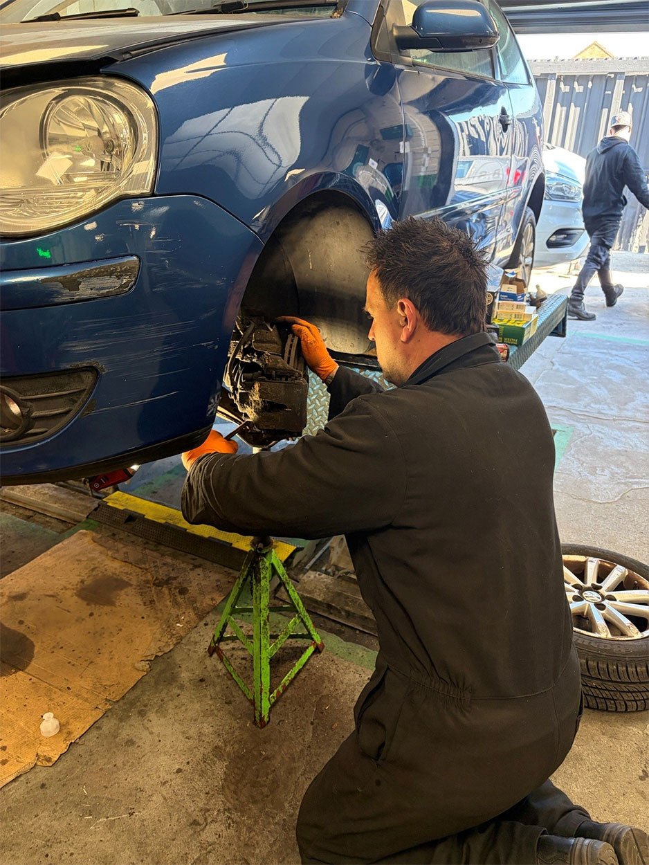 Head mechanic Ben fixing a car