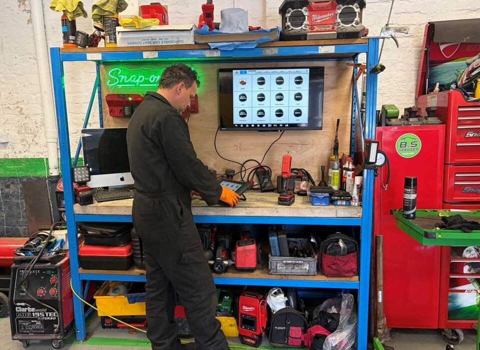 Head mechanic Ben performing a diagnostics check