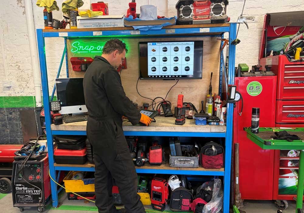 Head mechanic Ben performing a diagnostics check